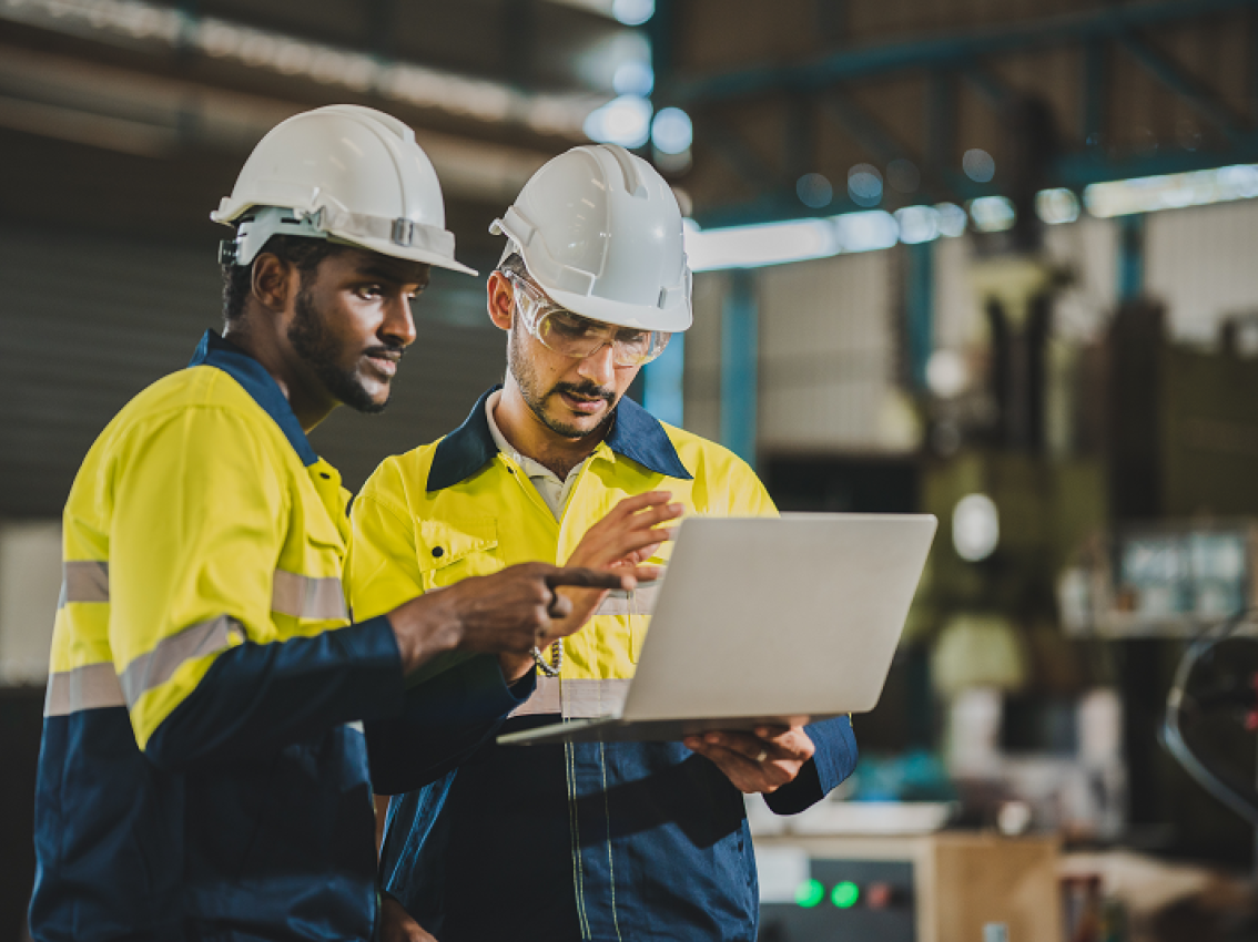 technicians analyzing system on laptop