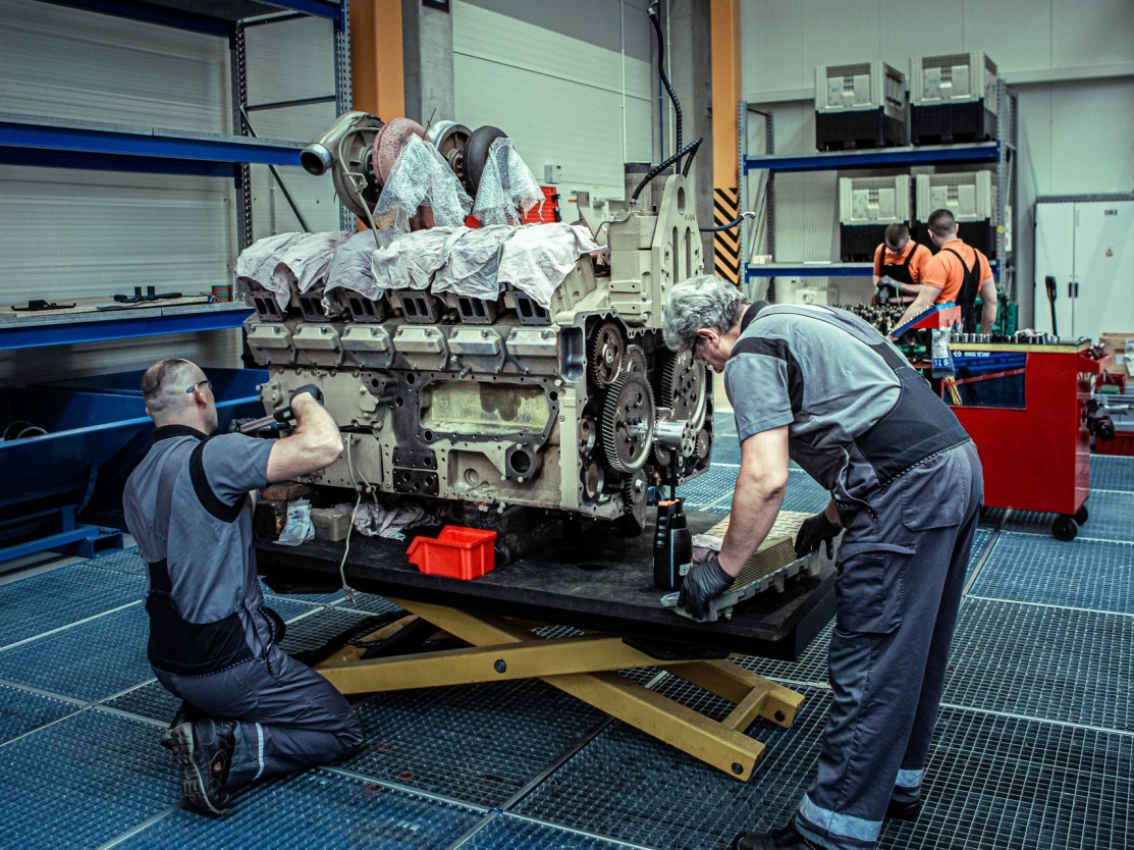 Mechanics working on an engine