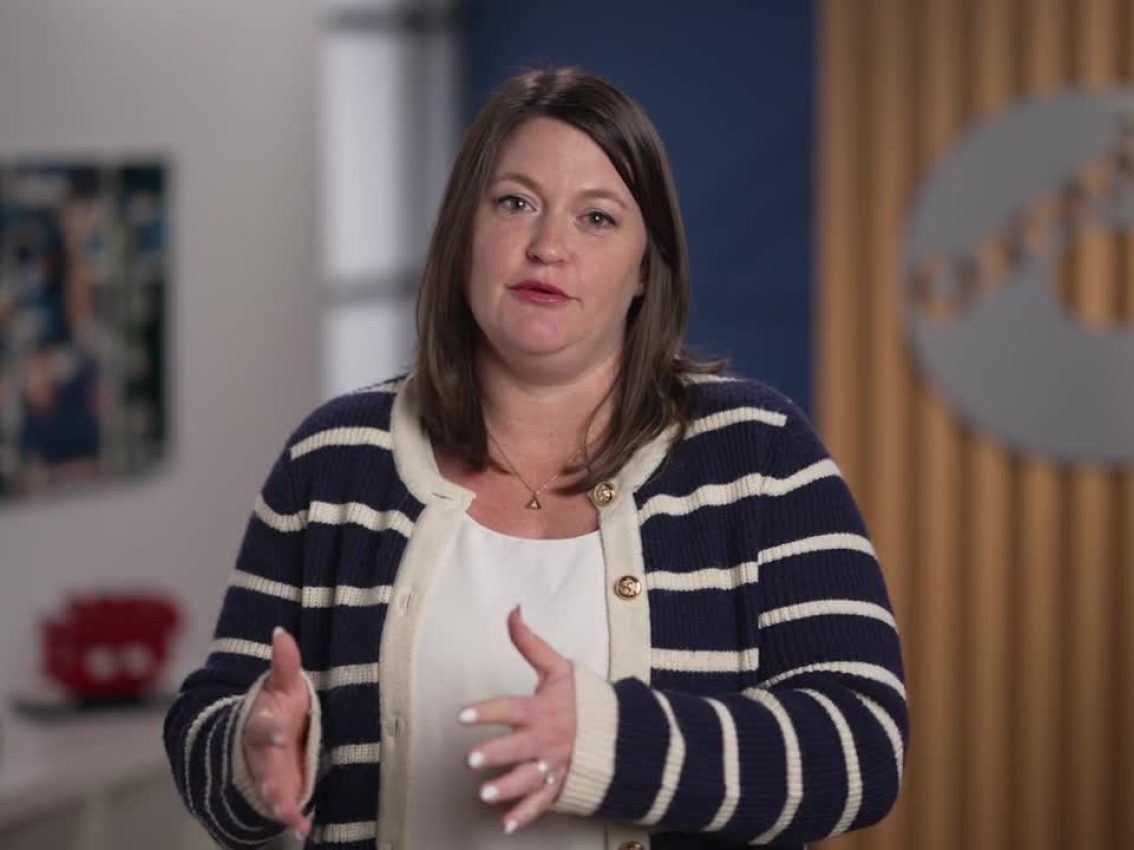 Molly Puga speaking in an office environment with Cummins branding