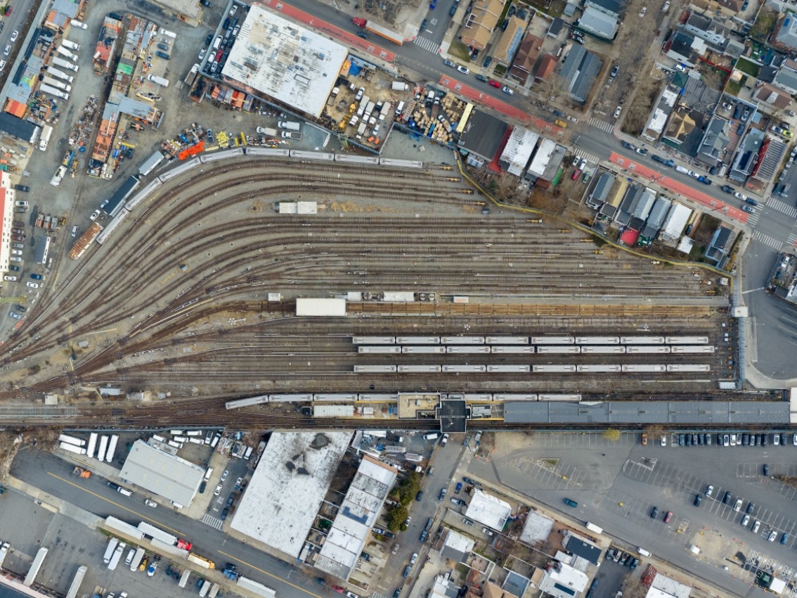 Aerial view of a large rail yard with multiple train tracks